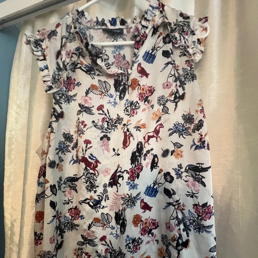 sleeveless ruffle neck top